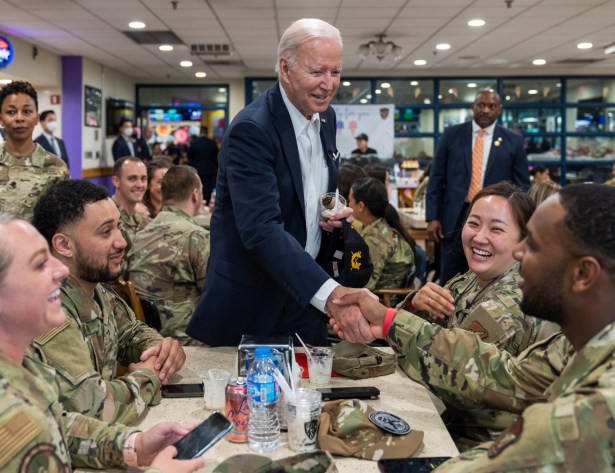 President Joe Biden greets World War II veterans, Wednesday, December 7, 2022, in the Roosevelt Room of the White House. He speaks with U.S. Army Corporal James Bennett.