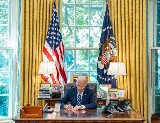 President Joe Biden works at the Resolute Desk before receiving a briefing from Secretary of Agriculture Tom Vilsack, Wednesday, July 31, 2024, in the Oval Office.